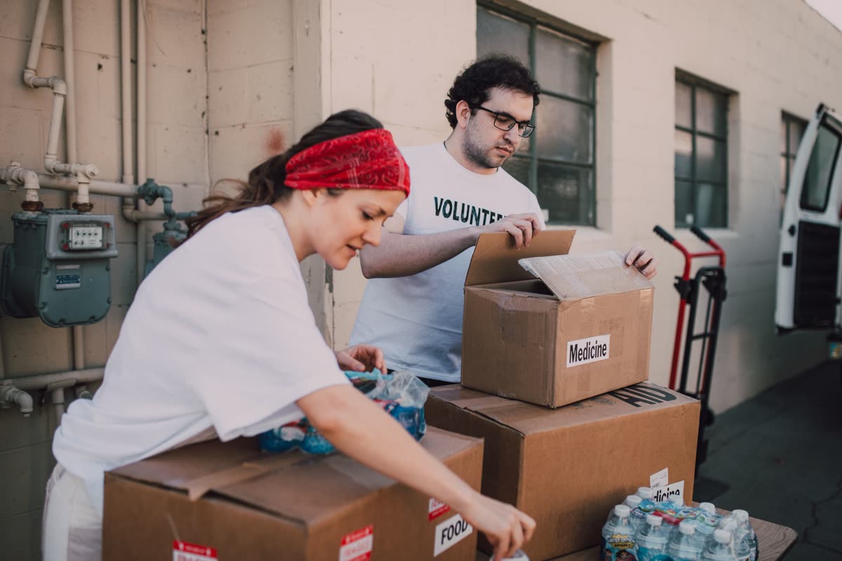 Volunteers packing relief supplies for Nepal flood relief